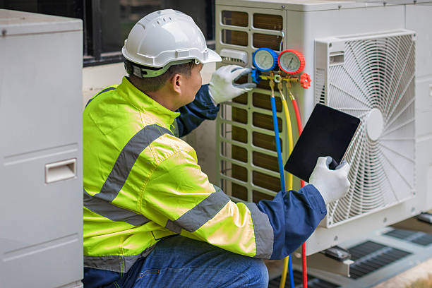 Professional Air Duct Cleaning technician working in Newark, AR